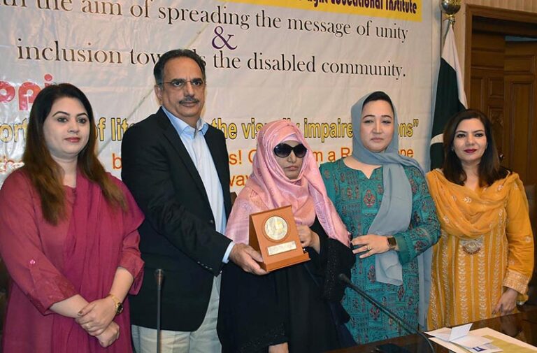 President Women Chamber of Commerce Dr. Maryam Nauman, Iram Naz (blind entrepreneur) and others presents shield to President SCCI Abdul Gahfoor Malik at the Annual Ceremony of Travel to Light Educational Institute